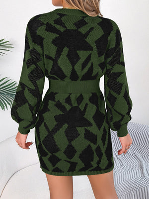 Army green knit mini dress with black geometric pattern, long sleeves, and belted waist.