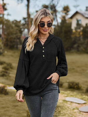 Black textured knit henley hoodie with balloon sleeves and button detail