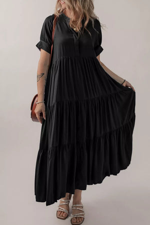 Black tiered maxi dress with short sleeves, V-neck and hidden placket, perfect for maternity.