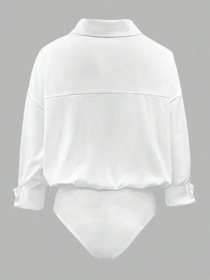 White collared long sleeve bodysuit with button cuffs and a cinched waist detail.