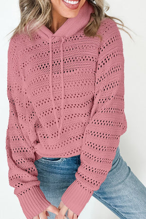 Dusty pink openwork knit hoodie with drawstring and ribbed cuffs.