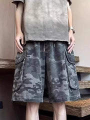Relaxed fit black camo cargo shorts with multiple pockets and drawstring waist.