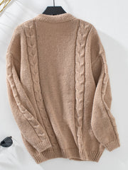 Tan cable knit cardigan with open front and braided sleeve details.