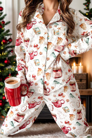 White collared pajama set with festive holiday print, long sleeves and pants.
