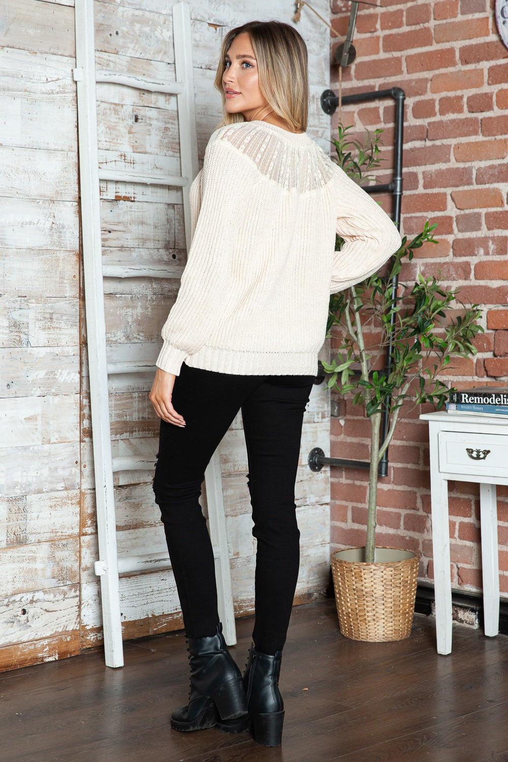 Cream ribbed knit pullover with lace yoke detail, long sleeves, and crew neck.