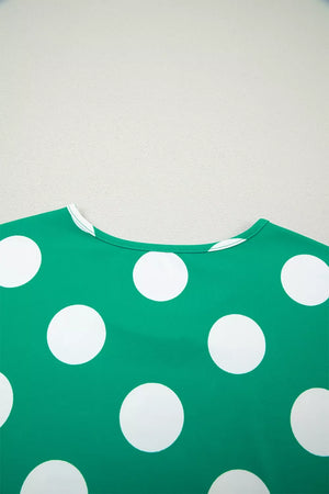 Green polka dot cropped tee with white polka dots and a crew neck.