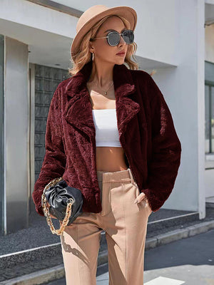 Burgundy faux fur biker jacket with notched lapels and a relaxed fit.