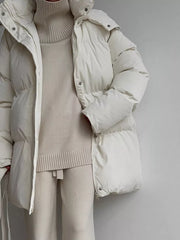 Ivory white puffer trench coat with hood, buttoned front and belted waist.