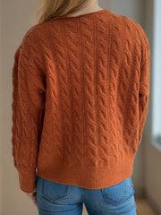 Caramel cable knit cardigan with puff sleeves, acrylic material, crew neckline.