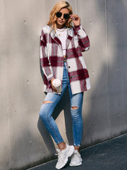 Oversized burgundy plaid shacket with hood and white tee, styled with ripped jeans.