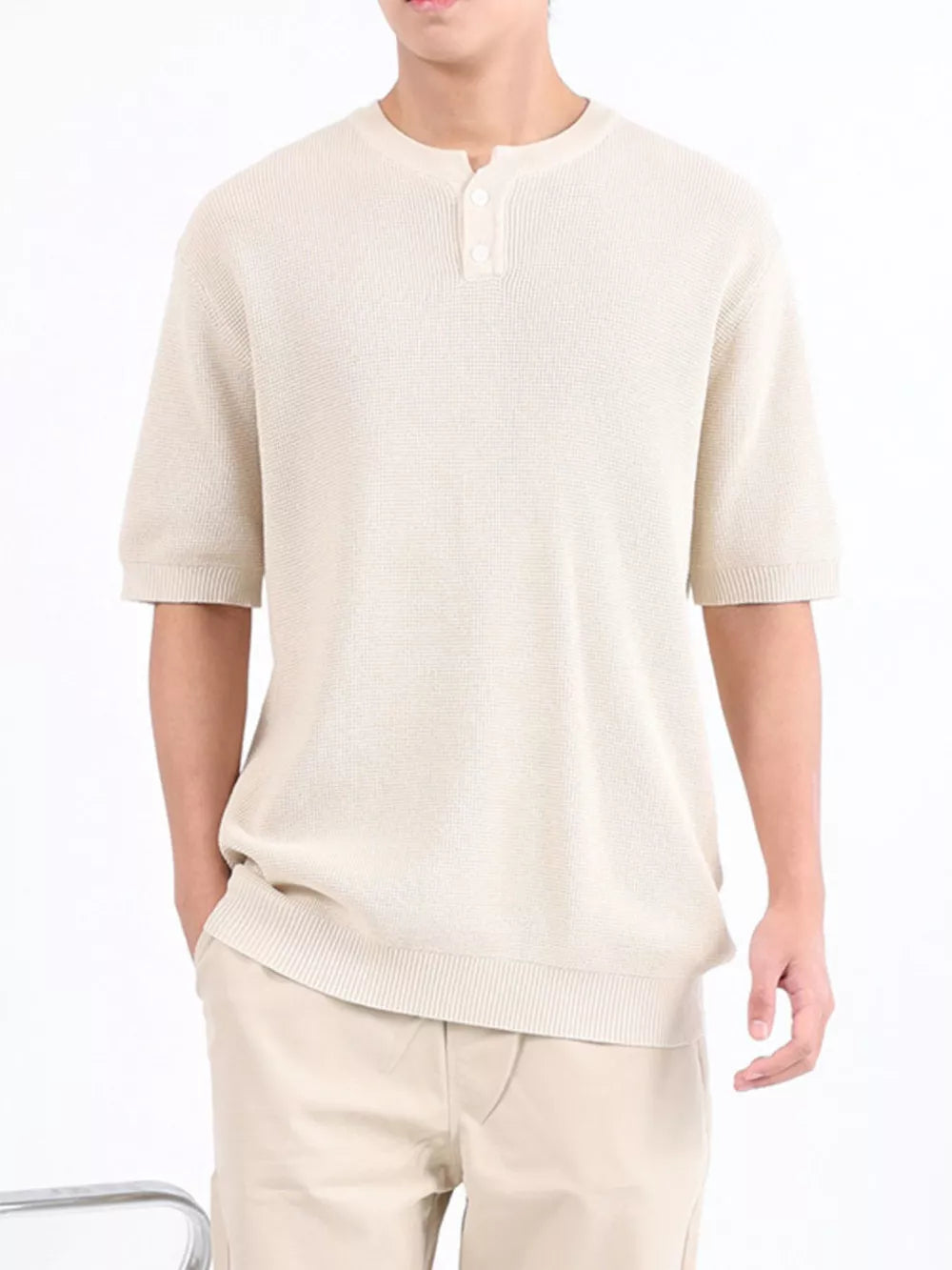 Apricot textured knit short sleeve henley with button placket and ribbed hem