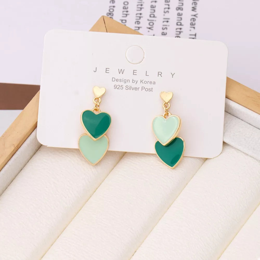 Charming double heart enamel earrings in dark green and light green with gold accents.