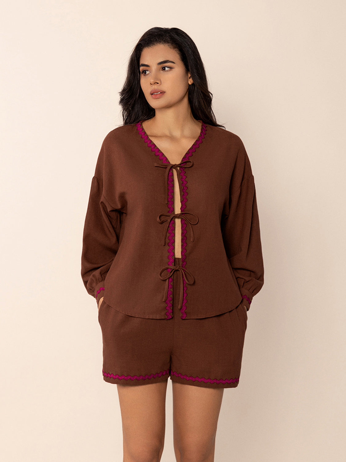 Brown linen tie-front pajama set with scallop trim and bow details.