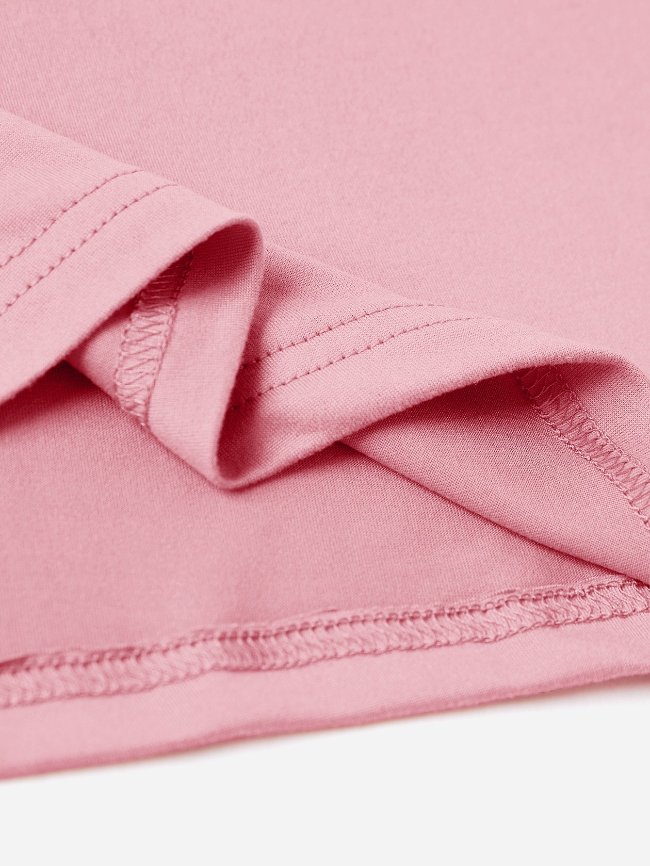 Blush pink t-shirt with visible stitching detail on hem and sleeve.
