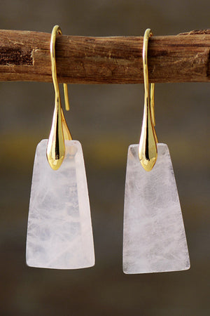 Trapezoid drop earrings with gold hooks and pale pink stones.