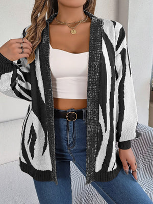 Zebra stripe open-front knit cardigan in black and white acrylic.