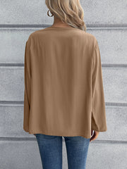 Camel long sleeve button-down blouse with mandarin collar, shown from the back.