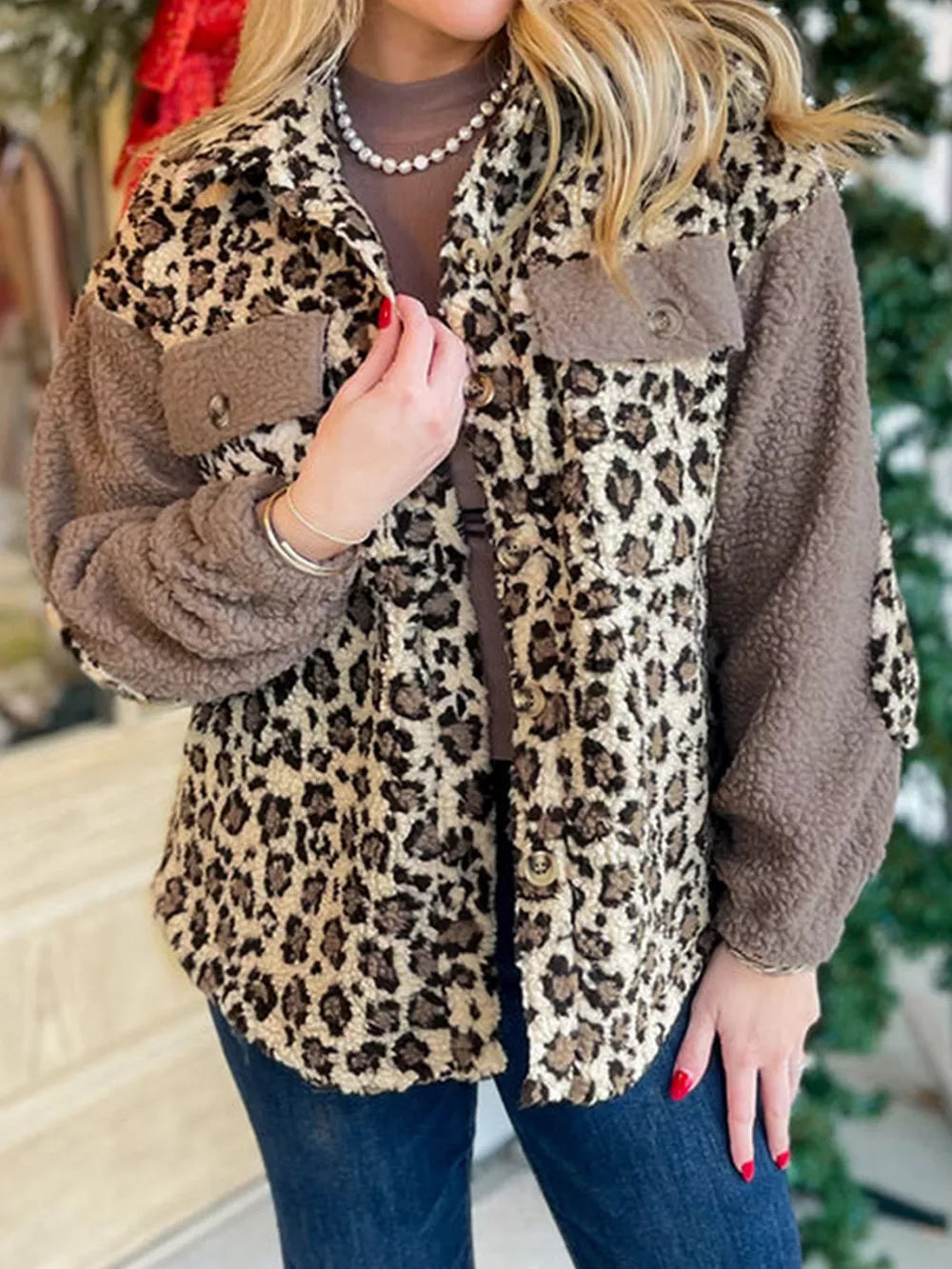 Plush leopard print fleece jacket with button-down front and brown sherpa sleeves.