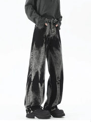 Men's plus-size relaxed fit black acid wash jeans with a belted waist.