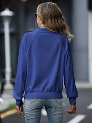 Royal blue ribbed zip-up track jacket with raglan sleeves and elastic cuffs.