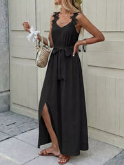 Black lace-trimmed maxi gown with V-neck, sleeveless, belted waist, and thigh-high slit.