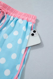 Pastel blue polka dot pajama shorts with pink trim and drawstring waist.