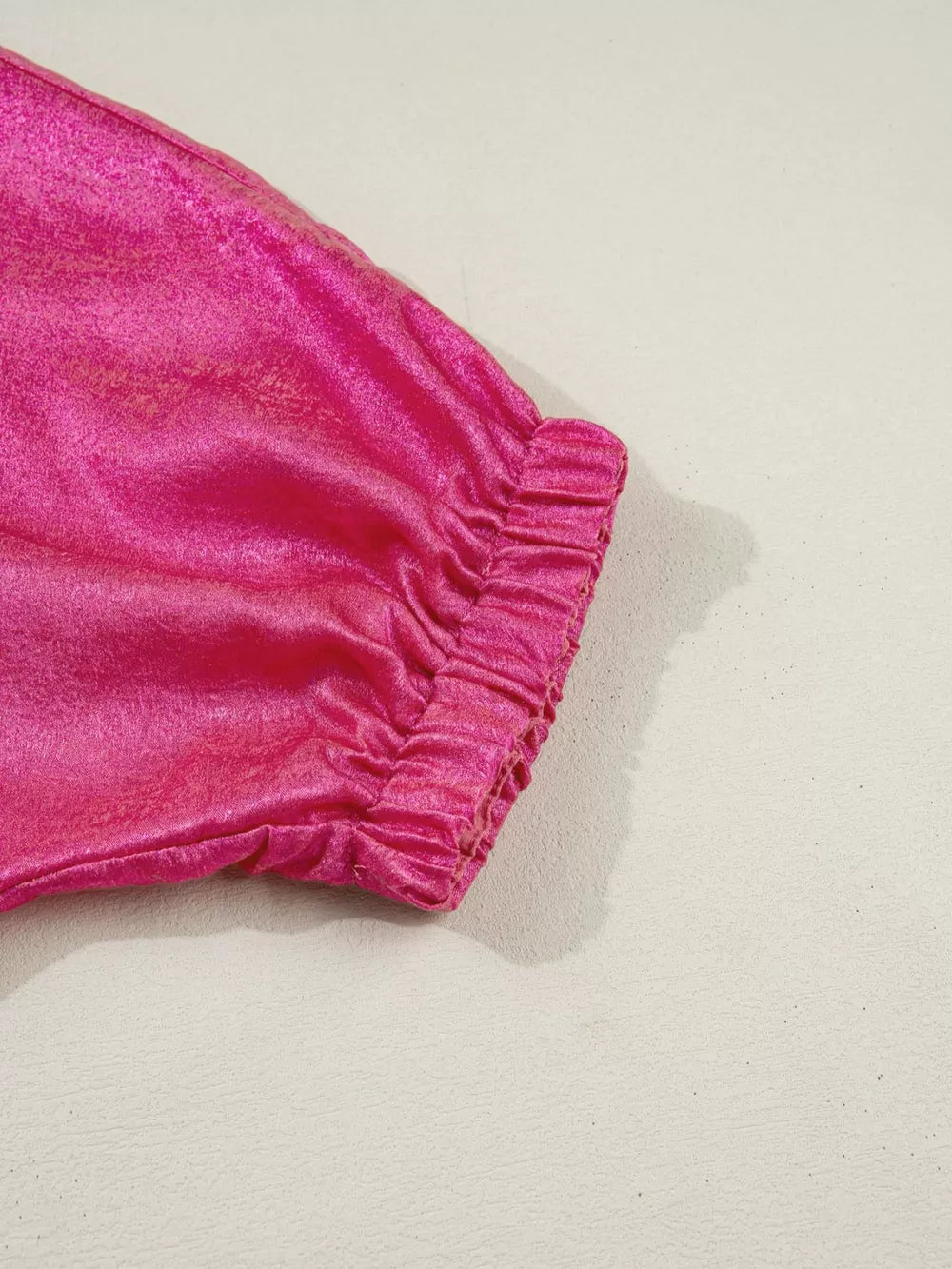 Lustrous deep rose metallic polyester maternity shirt with ruched cuff detail.