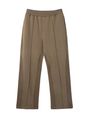 Taupe lounge trousers with vertical seam details and a relaxed fit.