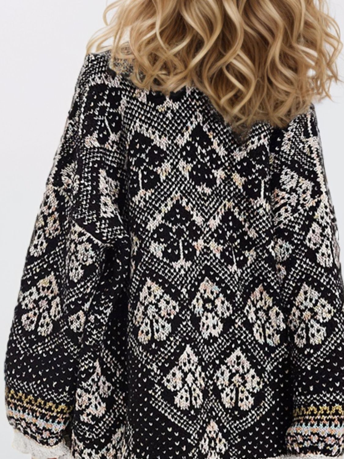 Geometric jacquard knit open cardigan in black with a diamond pattern.
