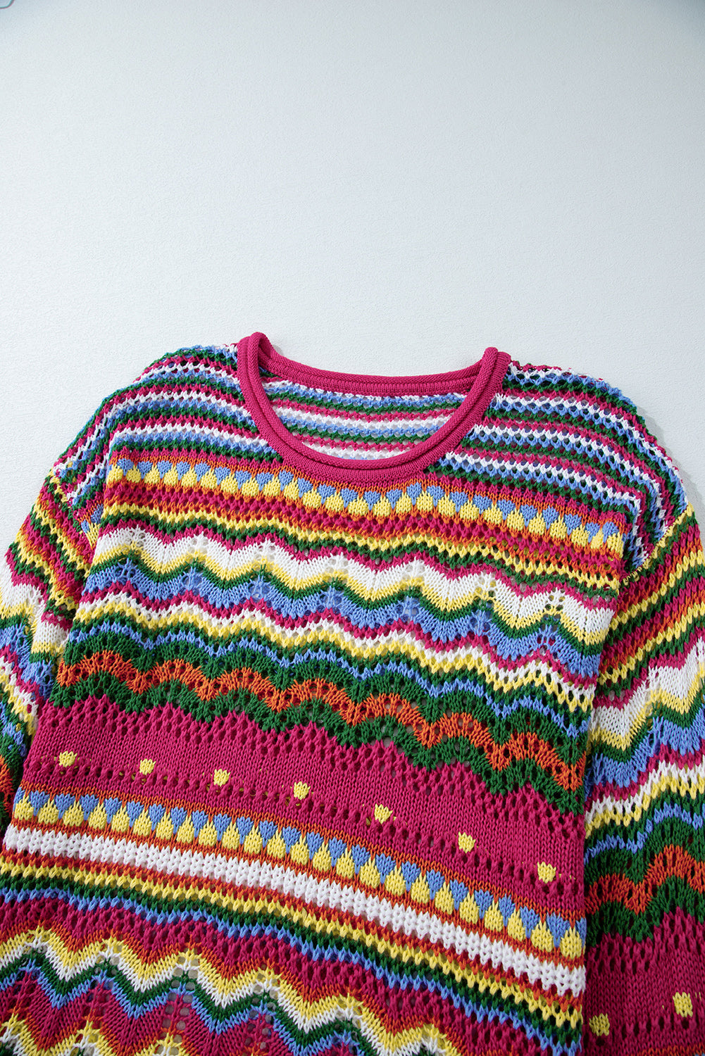 Multicolor crochet wave knit sweater with a crew neck and open knit details.