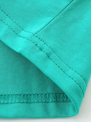 Children's teal cotton t-shirt detail showing seams and hem.