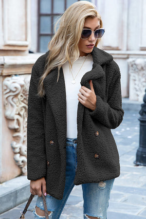 Black teddy pea coat with double-breasted buttons and notched lapels.