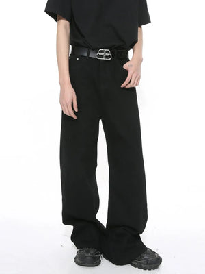 Black wide-leg denim jeans with a vintage wash, styled with a black t-shirt and belt.