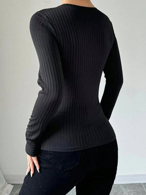 Black ribbed long sleeve bodysuit with a plunging mesh detail.