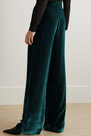 Dark green velvet palazzo trousers with a high waist and wide leg