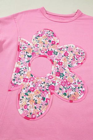 Pink cotton tunic t-shirt with a large floral patch applique and striped trim.