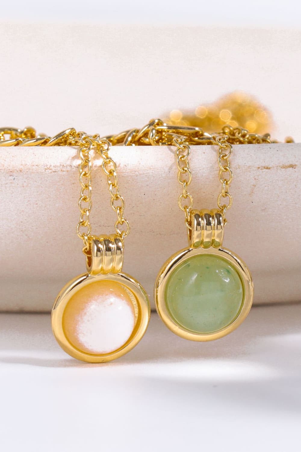 14K gold halo pendant necklaces with green and white aventurine orbs.