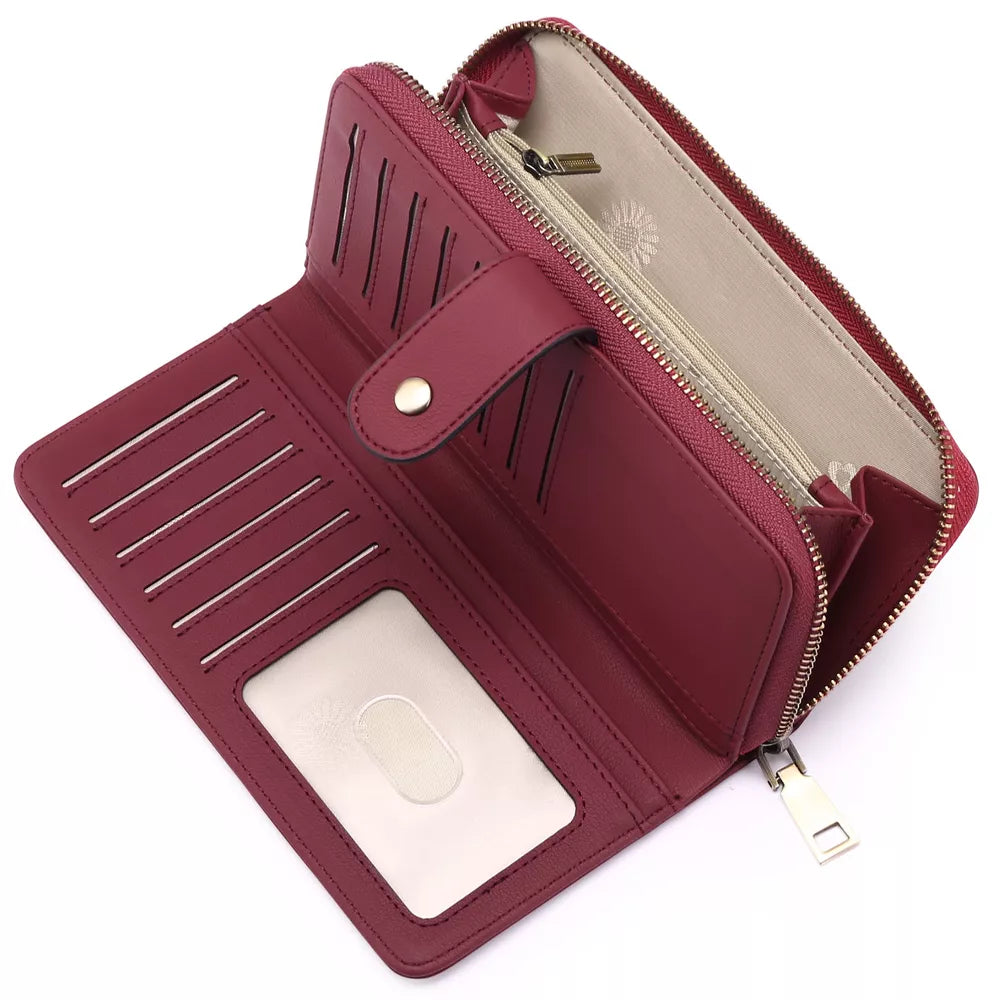 Burgundy pu leather mini wallet with snap closure, multiple card slots and zip compartment.