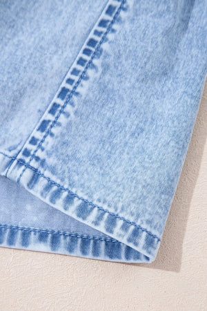 Light blue denim sundress with ruffled hem detail and visible stitching.
