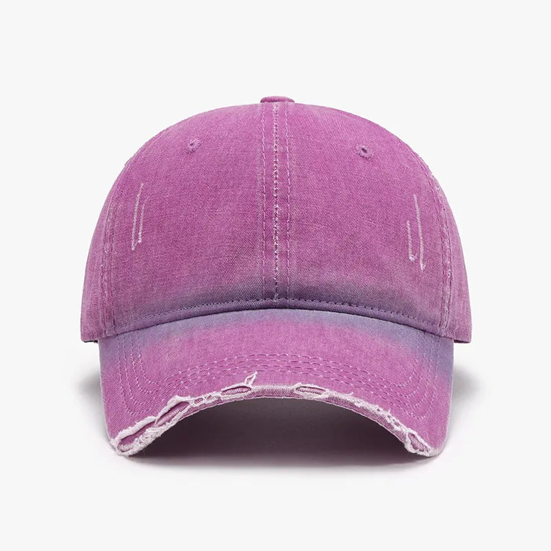 Faded denim baseball cap in purple with distressed details and frayed brim.