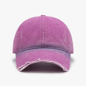 Faded denim baseball cap in purple with distressed details and frayed brim.