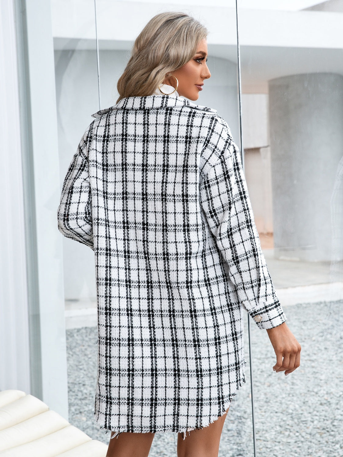 White plaid shacket with raw hem and textured fabric.