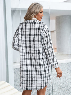 White plaid shacket with raw hem and textured fabric.