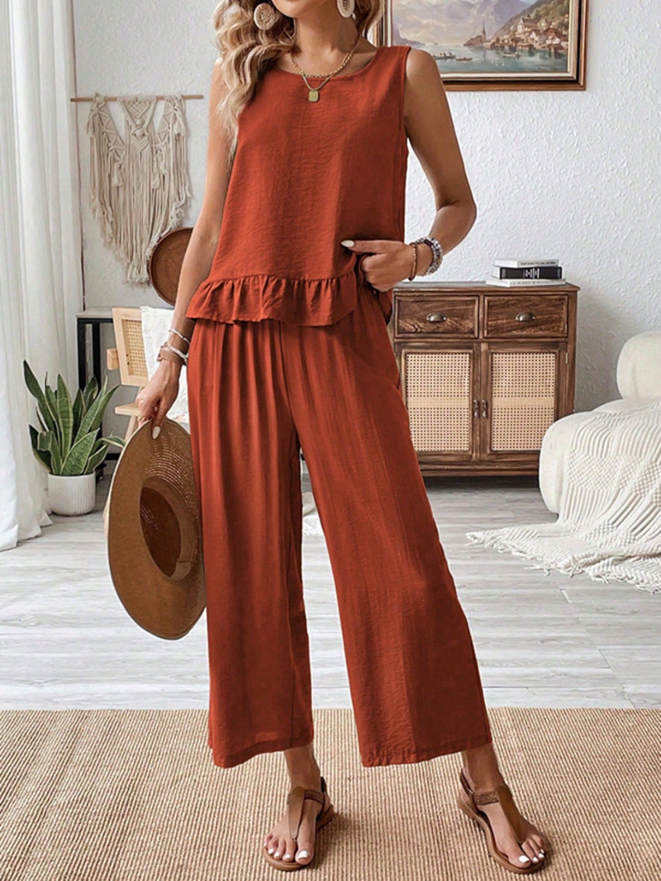 Ruffled hem tank top and flowing wide-leg pants set in rust orange.