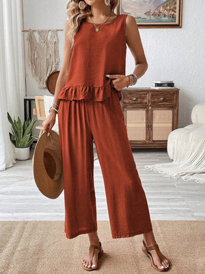 Ruffled hem tank top and flowing wide-leg pants set in rust orange.