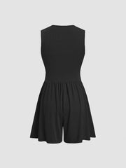 Black ribbed maternity romper with cinched waist and a-line shorts.