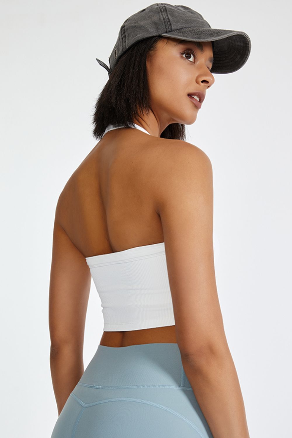 White ribbed halter crop top with a strappy back detail.