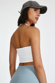 White ribbed halter crop top with a strappy back detail.