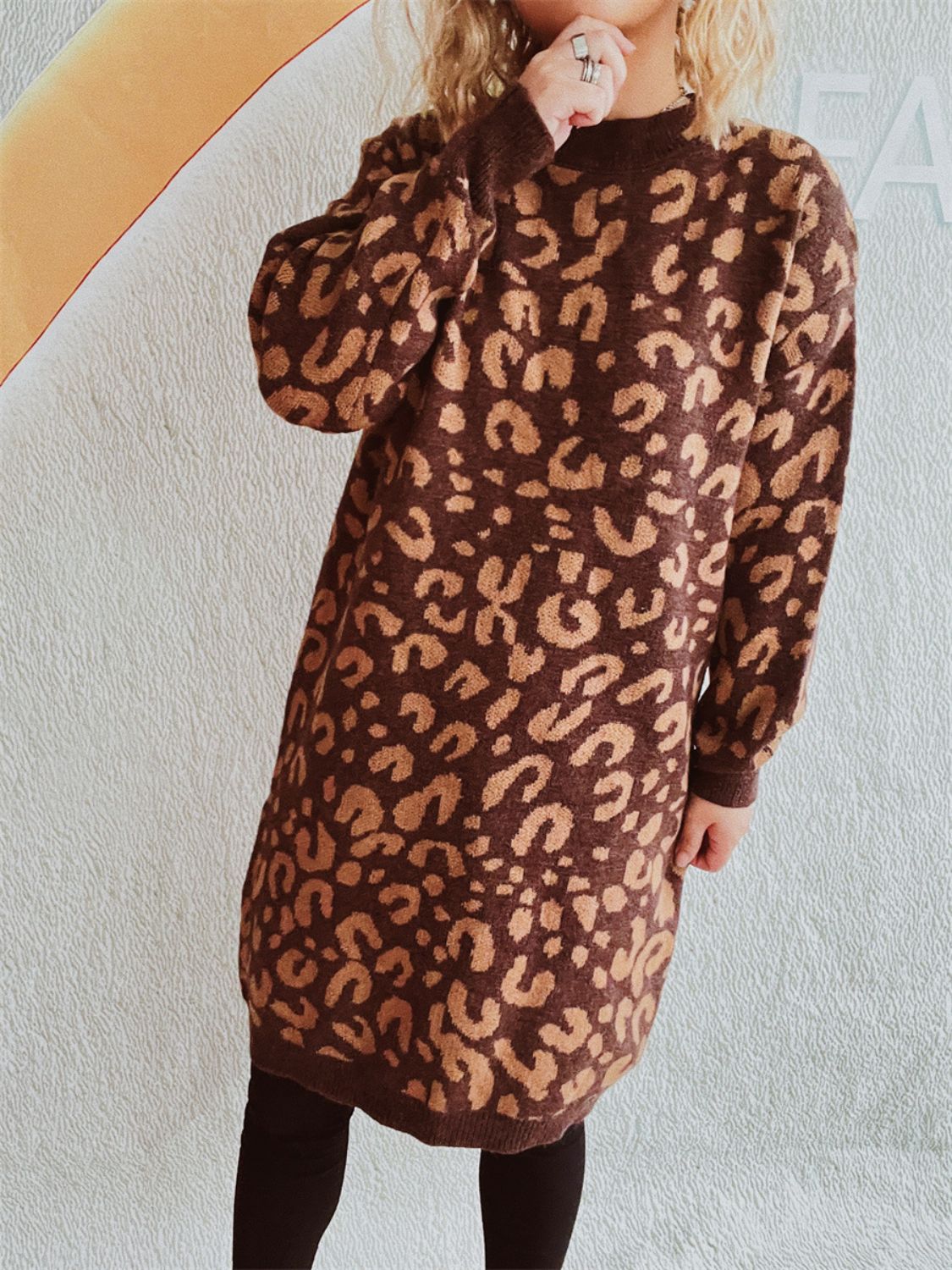 Leopard knit mini dress in caramel with long sleeves and a mock neck.