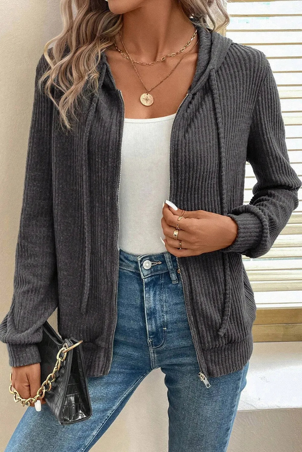 Textured ribbed knit zip-up hoodie in dark gray with pockets and a drawstring hood.